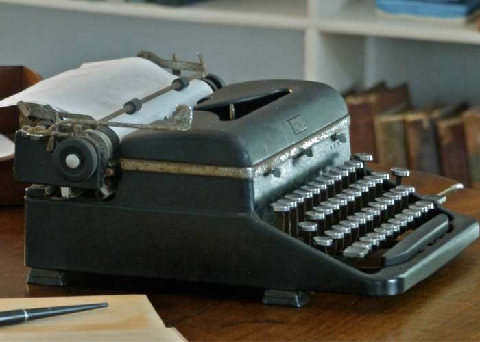 Smiling woman doing podcasts to support your sobriety